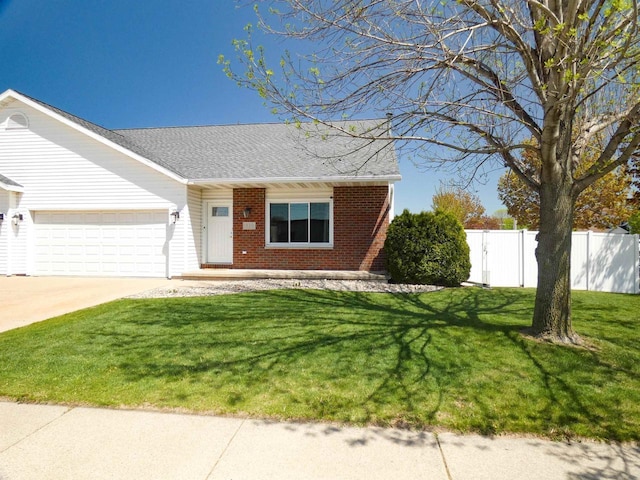 613 S Railroad St, Kimberly, WI 54136 - view of front of property featuring brick siding, a garage, driveway, and roof with shingles