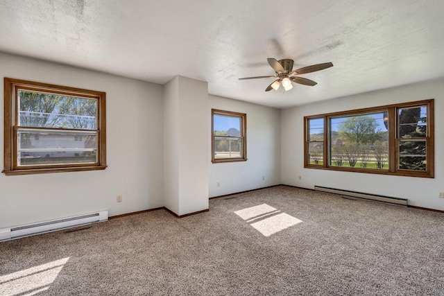 297 Walnut Dr, Onalaska, WI 54650 - spare room featuring a baseboard radiator, carpet, a baseboard heating unit, ceiling fan, and baseboards