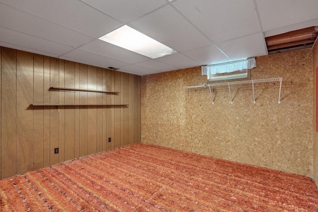 297 Walnut Dr, Onalaska, WI 54650 - below grade area with wood walls and a paneled ceiling