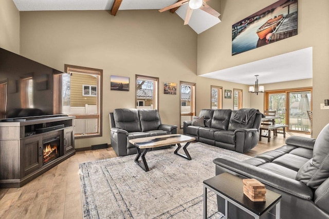 416 Sommers St, Stevens Point, WI 54481 - living room with ceiling fan, light wood-style floors, beam ceiling, a chandelier, and high vaulted ceiling