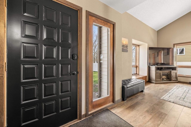 416 Sommers St, Stevens Point, WI 54481 - foyer with lofted ceiling, wood finished floors, and baseboards