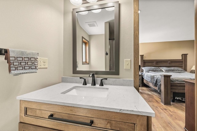 416 Sommers St, Stevens Point, WI 54481 - bathroom featuring wood finished floors and vanity