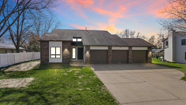 416 Sommers St, Stevens Point, WI 54481 - view of front of property with brick siding, a garage, driveway, and a shingled roof