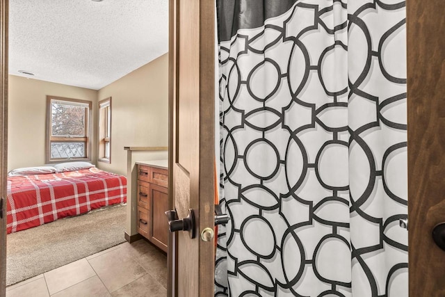 416 Sommers St, Stevens Point, WI 54481 - full bath featuring a textured ceiling, curtained shower, and tile patterned flooring