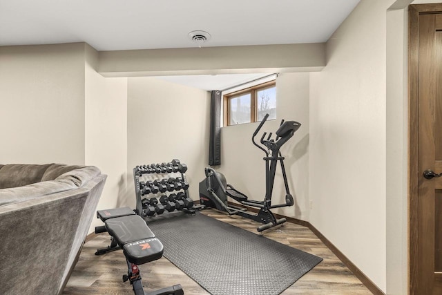 416 Sommers St, Stevens Point, WI 54481 - workout room with wood finished floors and baseboards