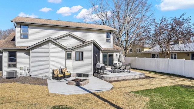 416 Sommers St, Stevens Point, WI 54481 - rear view of property with central AC unit, a patio, and a shingled roof
