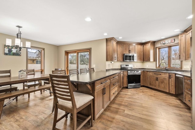 416 Sommers St, Stevens Point, WI 54481 - kitchen with appliances with stainless steel finishes, healthy amount of natural light, a sink, a peninsula, and recessed lighting