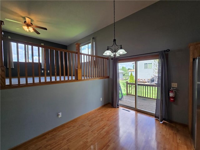 13570 42nd Ave, Chippewa Falls, WI 54729 - unfurnished dining area featuring a chandelier, ceiling fan, and wood finished floors