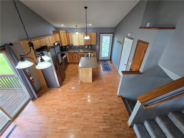 13570 42nd Ave, Chippewa Falls, WI 54729 - kitchen featuring a sink, stainless steel fridge with ice dispenser, light wood-style flooring, and a kitchen island