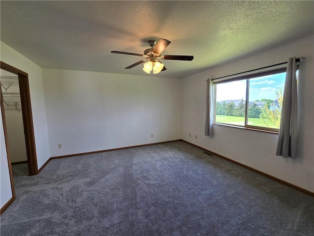 13570 42nd Ave, Chippewa Falls, WI 54729 - empty room featuring carpet, ceiling fan, baseboards, and a textured ceiling