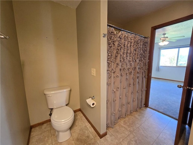 13570 42nd Ave, Chippewa Falls, WI 54729 - bathroom with toilet, tile patterned floors, baseboards, and ceiling fan