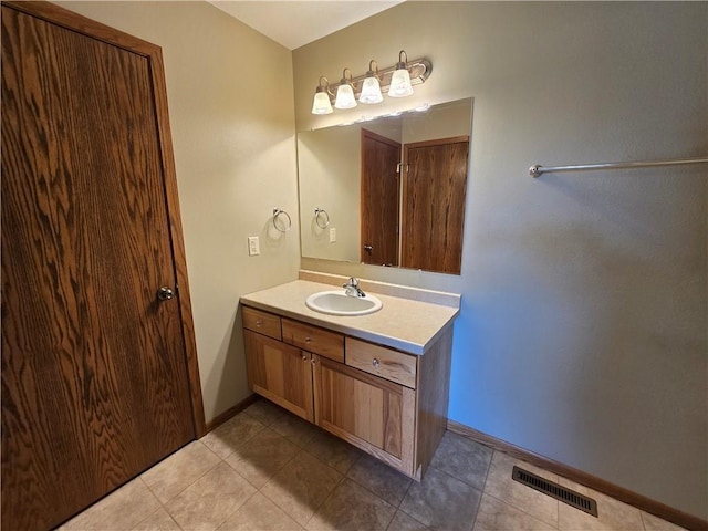 13570 42nd Ave, Chippewa Falls, WI 54729 - bathroom with baseboards, vanity, and tile patterned floors