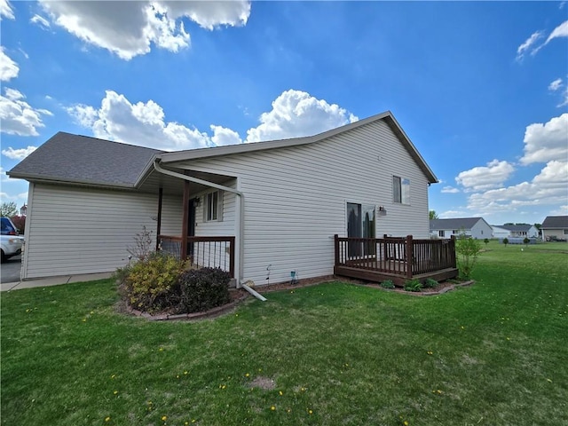 13570 42nd Ave, Chippewa Falls, WI 54729 - view of property exterior featuring a deck and a lawn