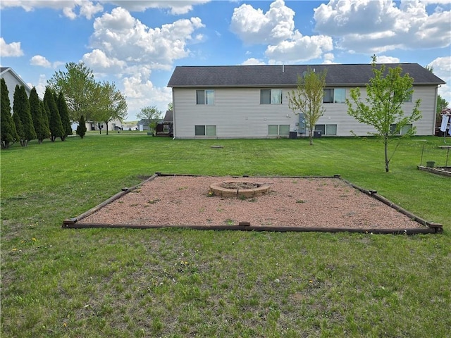 13570 42nd Ave, Chippewa Falls, WI 54729 - view of green lawn featuring an outdoor fire pit