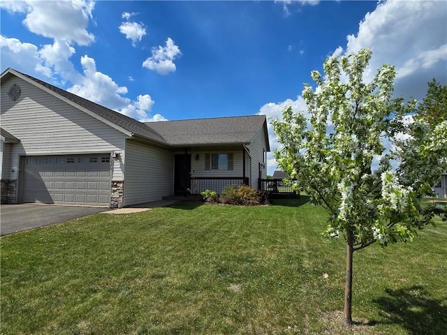 13570 42nd Ave, Chippewa Falls, WI 54729 - view of front of home featuring an attached garage, a front yard, asphalt driveway, and roof with shingles