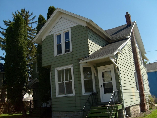 701 Otter Ave, Oshkosh, WI 54901 - view of front of home featuring a chimney and roof with shingles