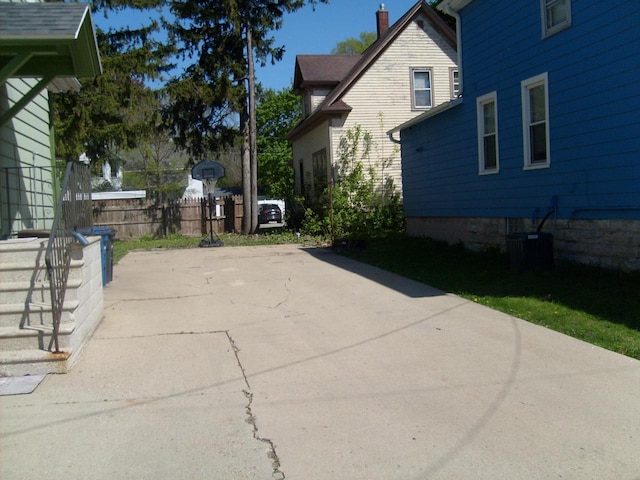 701 Otter Ave, Oshkosh, WI 54901 - view of patio featuring central air condition unit and fence