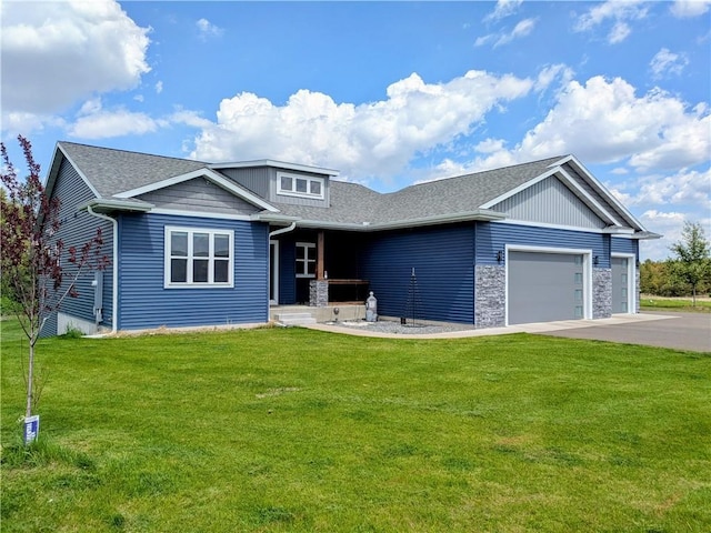 20398 64th Ave, Chippewa Falls, WI 54729 - view of front of house featuring a garage, a front yard, driveway, roof with shingles, and stone siding
