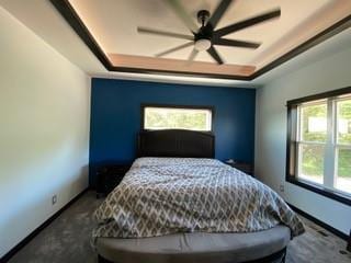 20398 64th Ave, Chippewa Falls, WI 54729 - bedroom featuring a raised ceiling, baseboards, carpet, and ceiling fan
