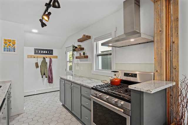 3486 Hargrove St, Madison, WI 53714 - kitchen with wall chimney exhaust hood, gas stove, gray cabinets, vaulted ceiling, and light stone countertops