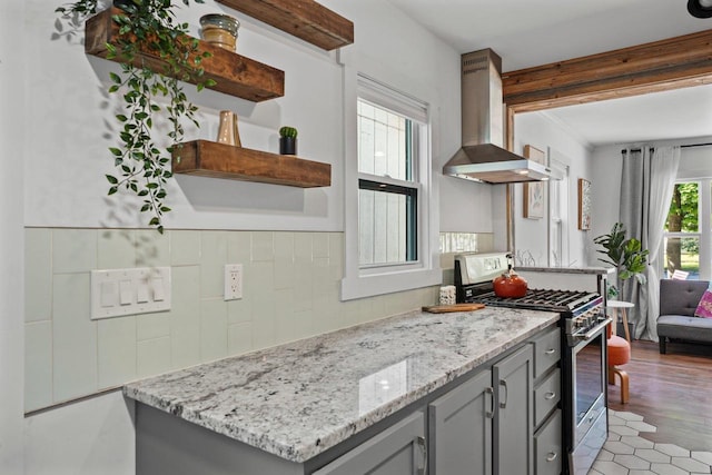 3486 Hargrove St, Madison, WI 53714 - kitchen with gas stove, exhaust hood, open shelves, gray cabinetry, and light stone countertops