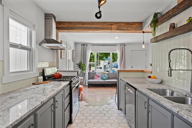 3486 Hargrove St, Madison, WI 53714 - kitchen featuring wall chimney range hood, appliances with stainless steel finishes, a sink, gray cabinets, and open shelves