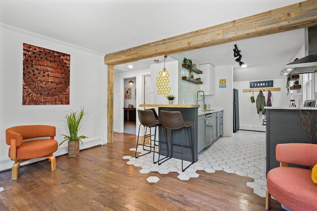 3486 Hargrove St, Madison, WI 53714 - indoor wet bar featuring light wood-style flooring, stainless steel dishwasher, freestanding refrigerator, ornamental molding, and baseboards