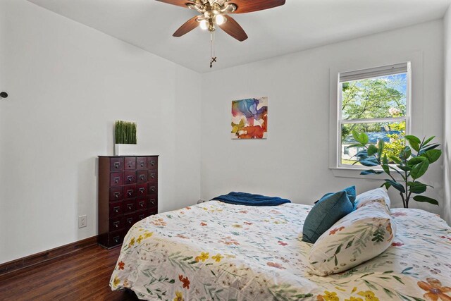 3486 Hargrove St, Madison, WI 53714 - bedroom with dark wood-style floors, baseboards, and a ceiling fan