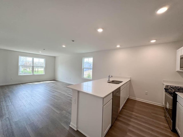 1126 58th Rd, Union Grove, WI 53182 - kitchen featuring stainless steel appliances, a peninsula, a sink, baseboards, and dark wood-type flooring