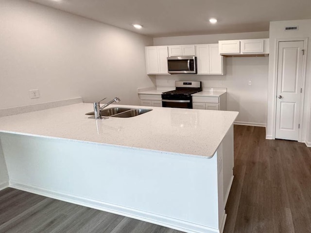 1126 58th Rd, Union Grove, WI 53182 - kitchen featuring stainless steel appliances, a sink, a peninsula, white cabinetry, and recessed lighting
