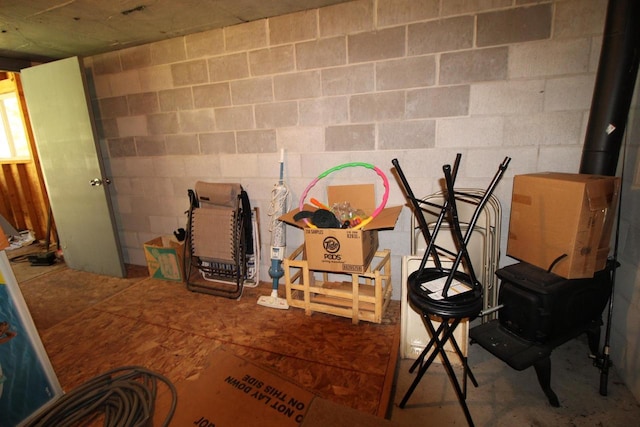 N9394 21st Ave, Neshkoro, WI 54960 - basement featuring a wood stove and concrete block wall