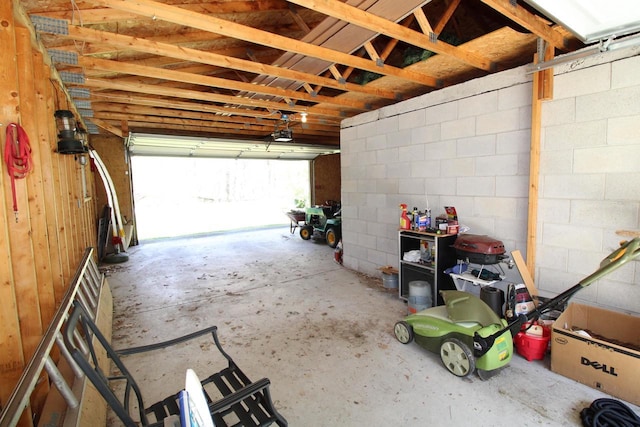 N9394 21st Ave, Neshkoro, WI 54960 - garage featuring a garage door opener and concrete block wall