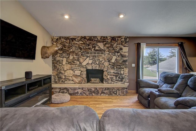 N492 County Road D, Eau Galle, WI 54737 - living room with wood finished floors, a fireplace, and baseboards