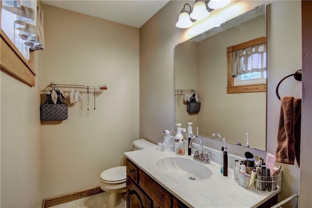 N492 County Road D, Eau Galle, WI 54737 - half bathroom with toilet, vanity, tile patterned flooring, and baseboards