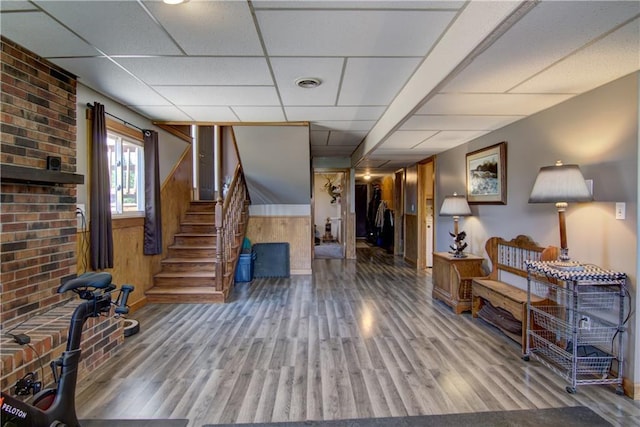 N492 County Road D, Eau Galle, WI 54737 - basement with wood finished floors, stairway, a paneled ceiling, and baseboards
