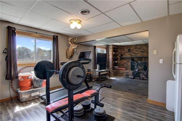 N492 County Road D, Eau Galle, WI 54737 - exercise area with a paneled ceiling, baseboards, and wood finished floors