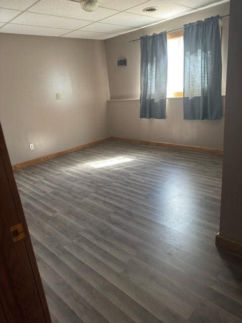 N492 County Road D, Eau Galle, WI 54737 - unfurnished room with baseboards, wood finished floors, and a paneled ceiling