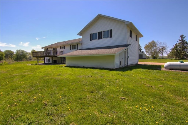 N492 County Road D, Eau Galle, WI 54737 - rear view of property featuring a lawn and a wooden deck
