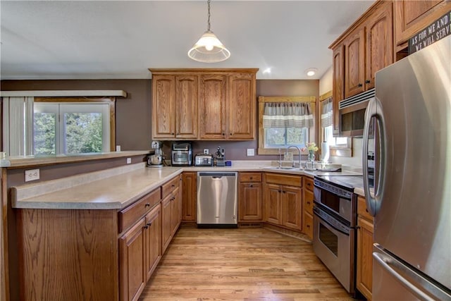 N492 County Road D, Eau Galle, WI 54737 - kitchen with stainless steel appliances, plenty of natural light, light wood-type flooring, a peninsula, and recessed lighting