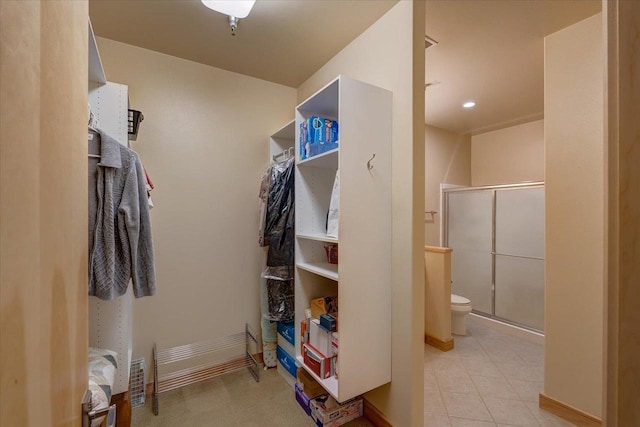 6767 Frank Lloyd Wright Ave Unit 219, Middleton, WI 53562 - walk in closet featuring light tile patterned floors