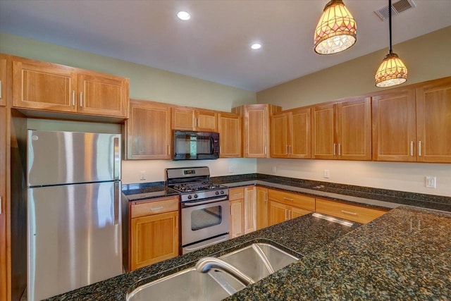 6767 Frank Lloyd Wright Ave Unit 219, Middleton, WI 53562 - kitchen with stainless steel appliances, decorative light fixtures, recessed lighting, dark stone counters, and a sink
