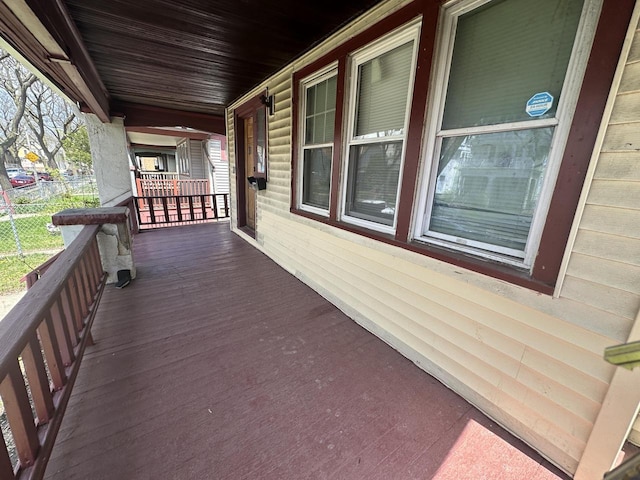wooden terrace featuring covered porch
