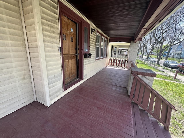 wooden deck featuring covered porch