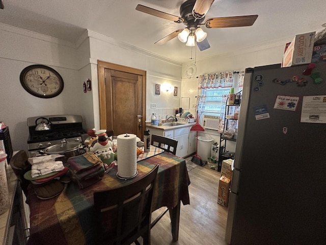 5733 W Philip Pl, Milwaukee, WI 53216 - dining area with ornamental molding, a ceiling fan, light wood-style flooring, and cooling unit