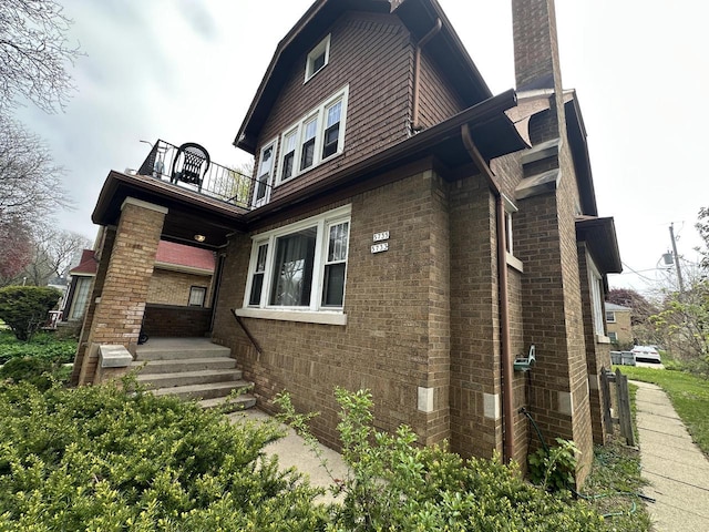 5733 W Philip Pl, Milwaukee, WI 53216 - view of side of home featuring a balcony and brick siding