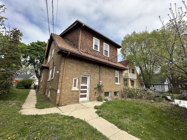 5733 W Philip Pl, Milwaukee, WI 53216 - view of side of property with a yard and brick siding
