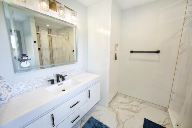 full bathroom with marble finish flooring, a stall shower, vanity, and decorative backsplash