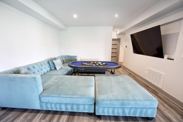 living room with wood finished floors, baseboards, and recessed lighting