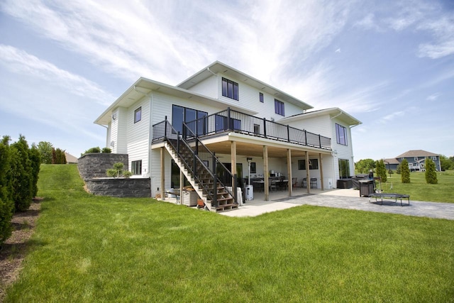 back of house with a patio area, a deck, stairs, and a yard