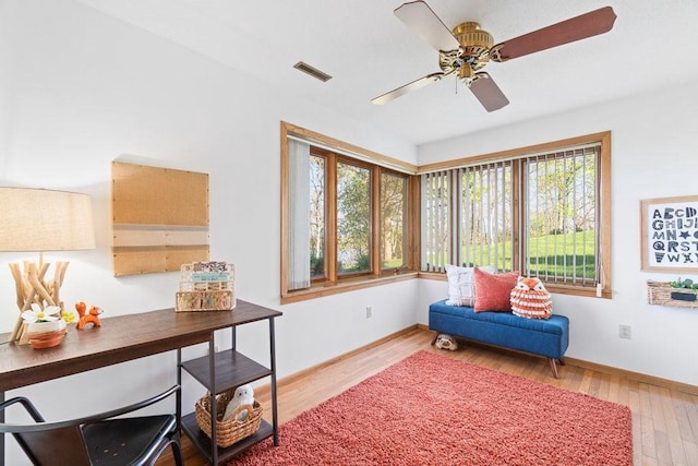 519 Grandview Heights Ct, Menomonie, WI 54751 - living area featuring plenty of natural light, wood finished floors, ceiling fan, and baseboards